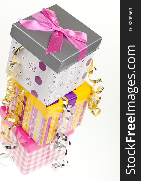Various gift boxes on a white background, with bow and ribbon. Various gift boxes on a white background, with bow and ribbon
