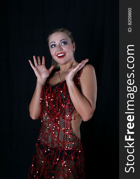 Lovely latin dancer against black background