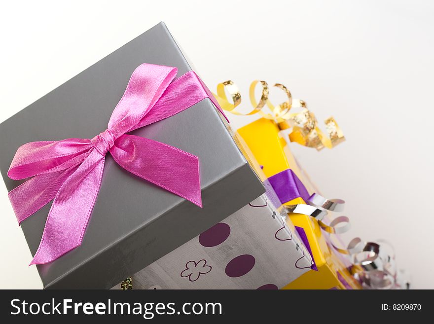 Various gift boxes on a white background, with bow and ribbon. Various gift boxes on a white background, with bow and ribbon