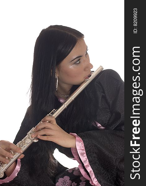 Portrait of a young woman in a black and pink dress with a flute. Portrait of a young woman in a black and pink dress with a flute