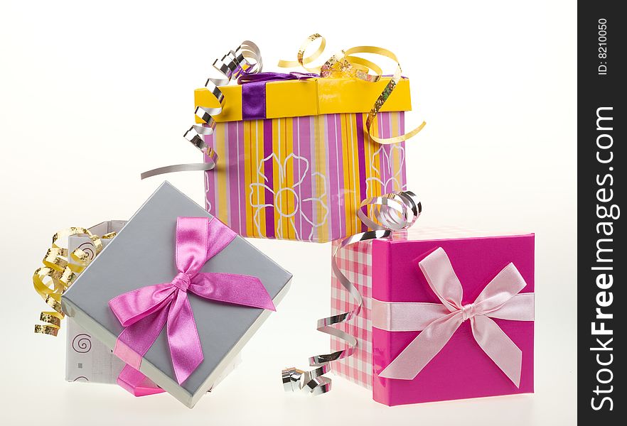 Various gift boxes on a white background, with bow and ribbon. Various gift boxes on a white background, with bow and ribbon