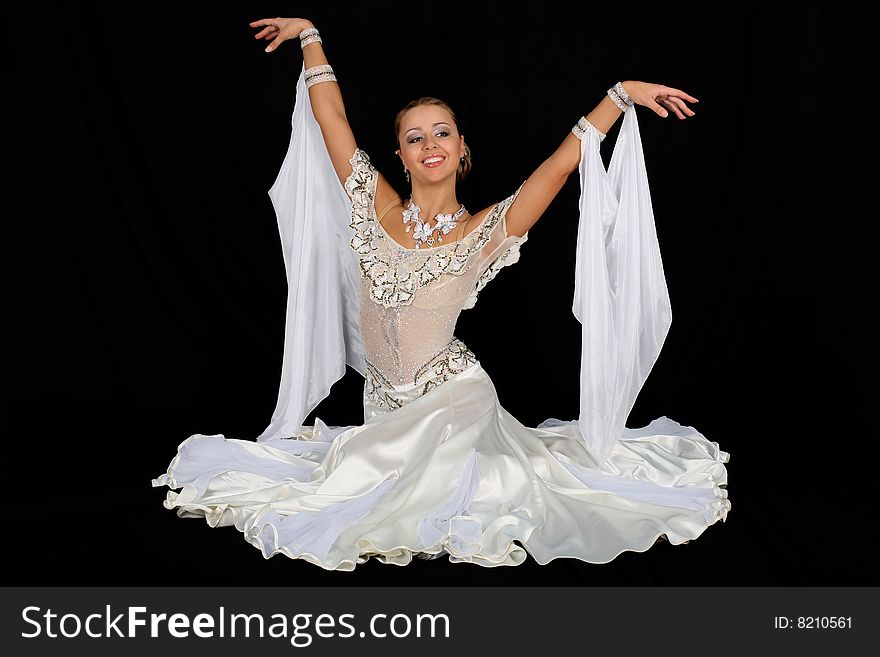 Blonde dancer in classical blue-white dress against black background. Blonde dancer in classical blue-white dress against black background