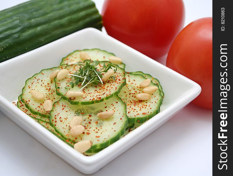 A fresh salad of cucumbers and pine corns