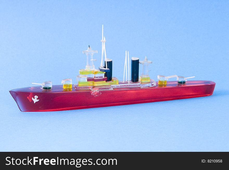 A red swimming ship on the sea. A red swimming ship on the sea