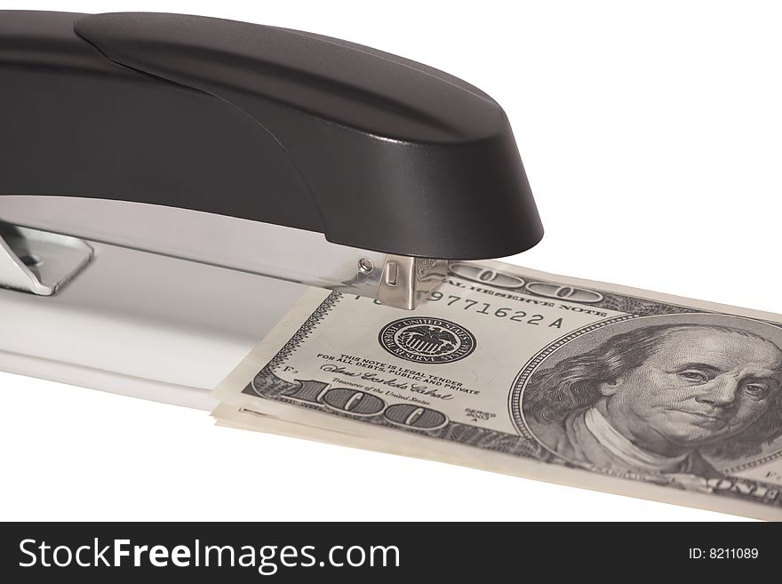 Stapler with stack of dollars isolated on white background. Stapler with stack of dollars isolated on white background
