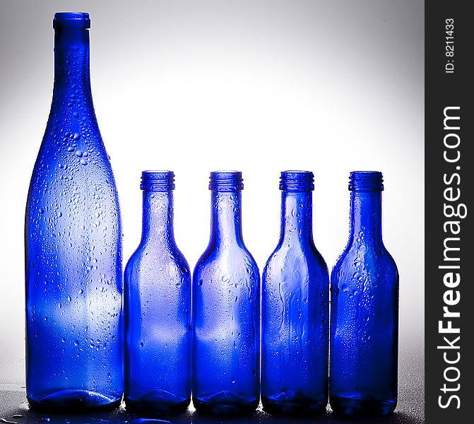 Background with creative bottles.GLASS
