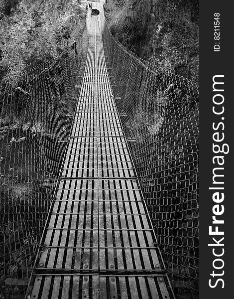 A photo of an old chain bridge in nepal