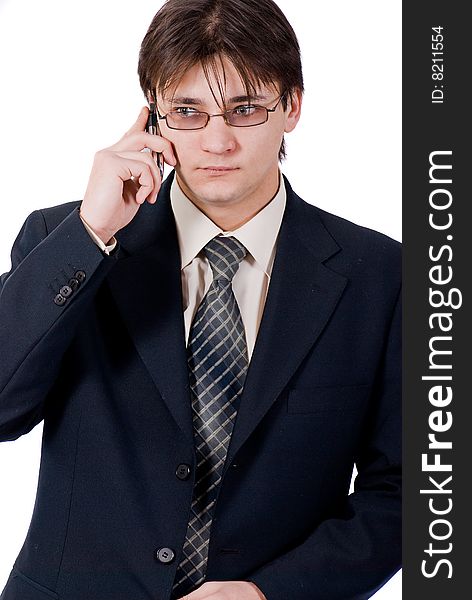 Young businessman calling by cellular phone. Over white