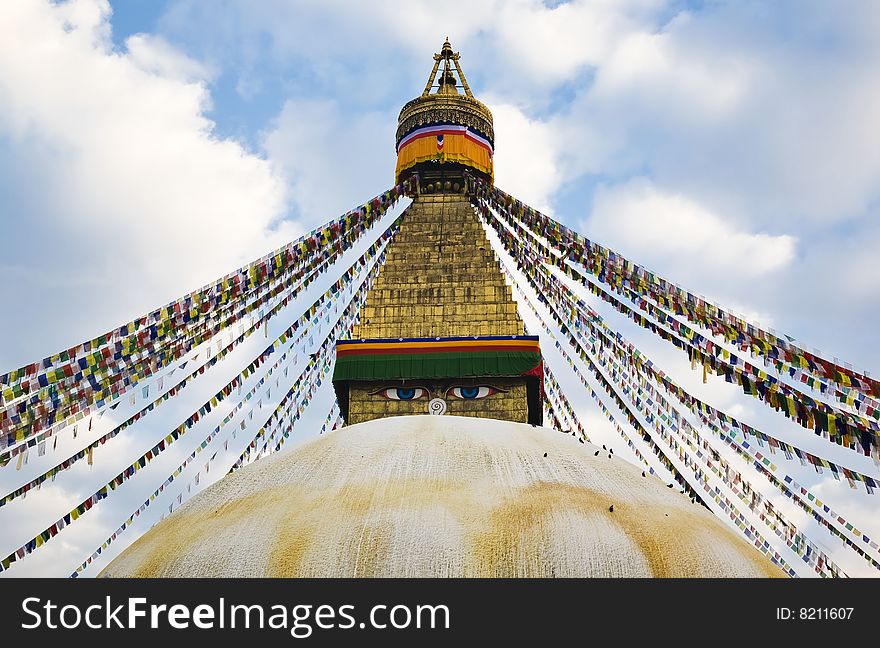 A huge buddhist stupa with colorful prayer flags in kathmandu.(nepal). A huge buddhist stupa with colorful prayer flags in kathmandu.(nepal)