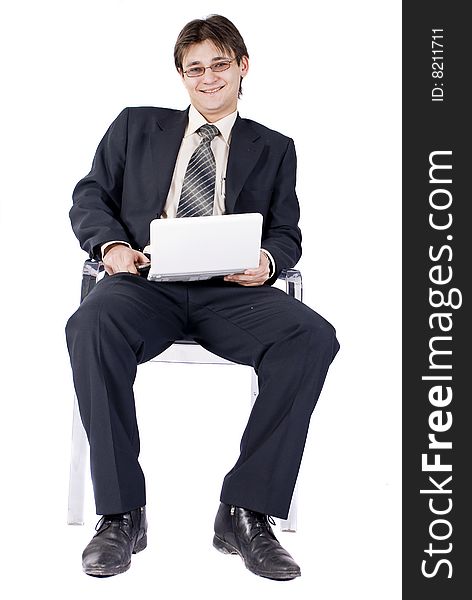 Businessman working on laptop computer, isolated on white background.