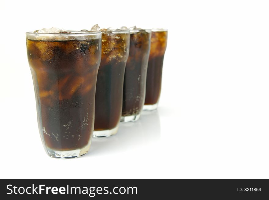 Glasses of cola isolated against a white background. Glasses of cola isolated against a white background