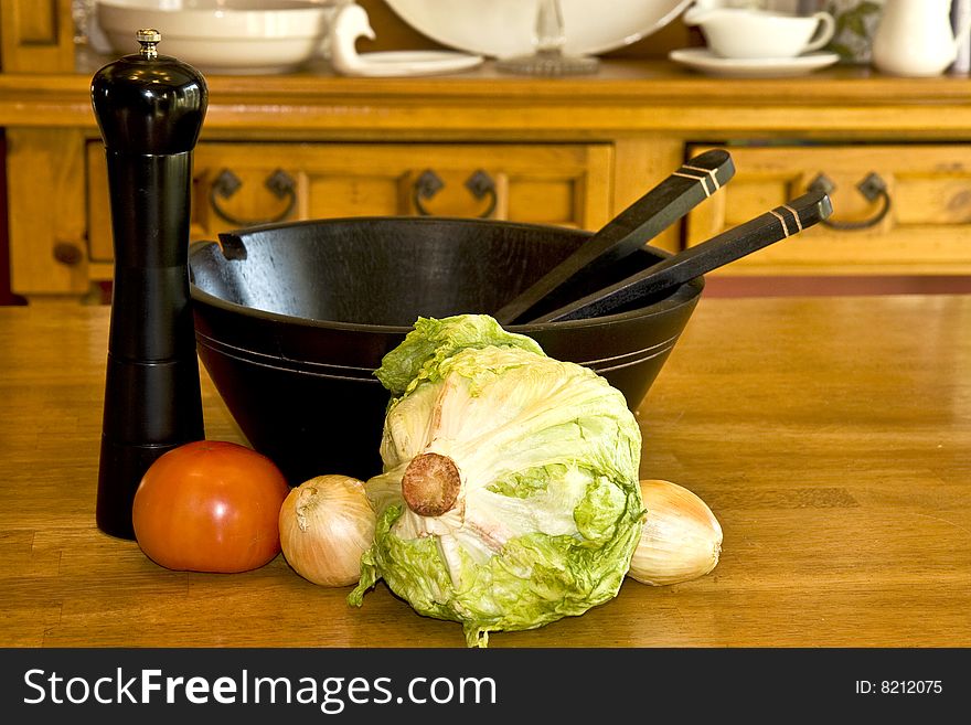 Preparation for a garden salad in a wooden bowl. Preparation for a garden salad in a wooden bowl