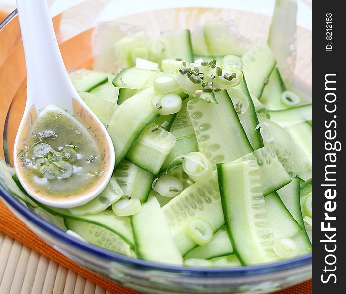 Fresh salad of cucumbers with spring onions