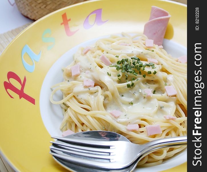 Fresh italian pasta with cheese-sauce and ham. Fresh italian pasta with cheese-sauce and ham