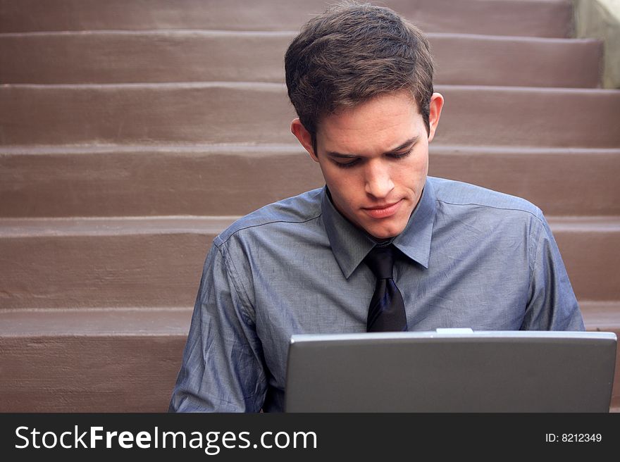 Businessman working on laptop checking messages