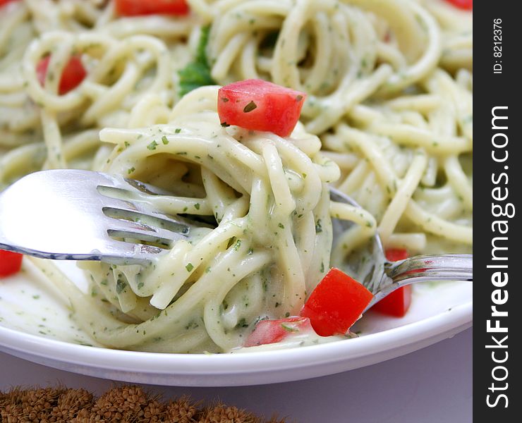 Fresh italian pasta with cheese-sauce and tomatoes. Fresh italian pasta with cheese-sauce and tomatoes