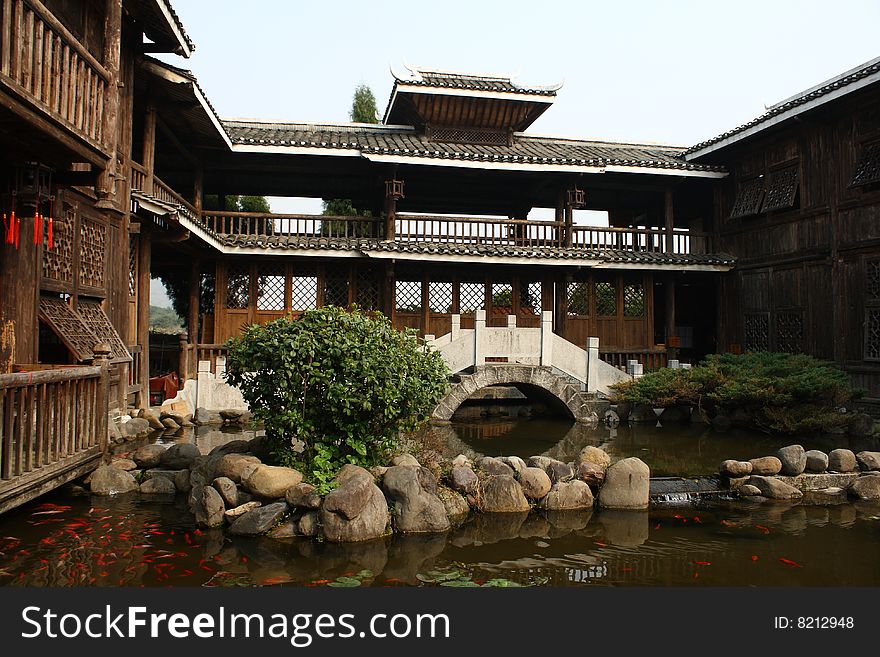 This is a chinese house. it have cistern and bridge. it in chinese guilin.