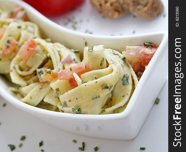 Fresh italian pasta with cheese-sauce and tomatoes. Fresh italian pasta with cheese-sauce and tomatoes