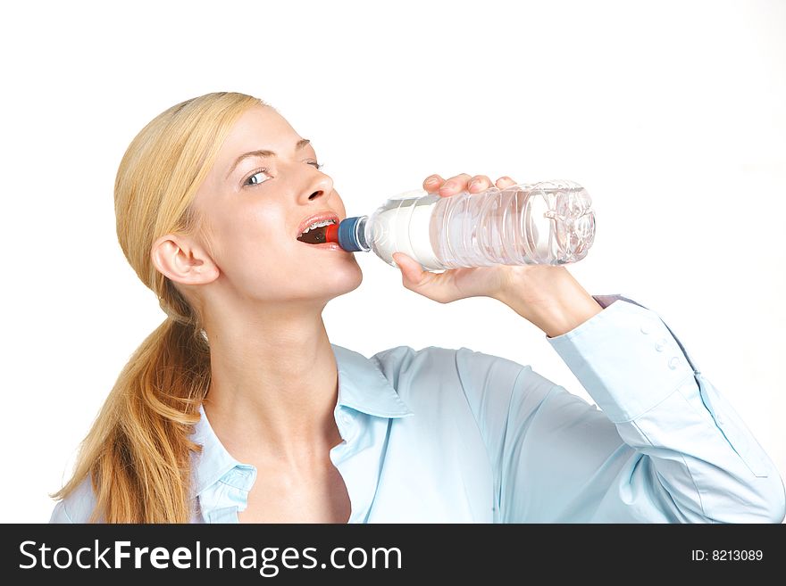 Business woman drinking water from a bottle