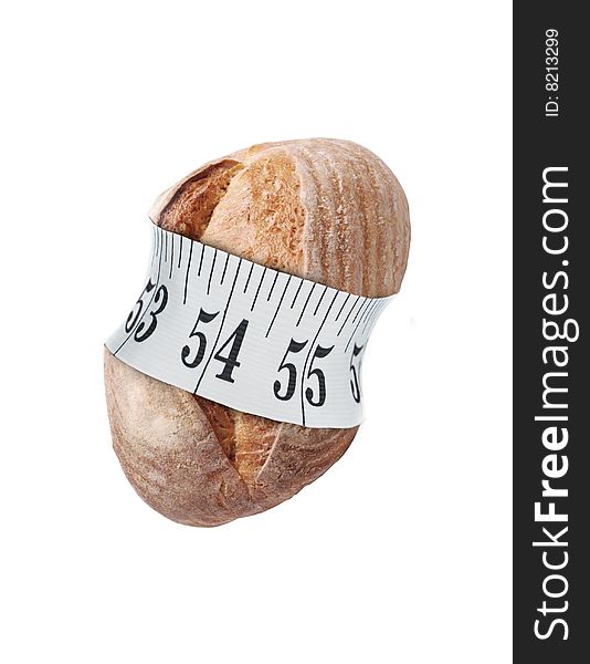 Bread with tape measure on white