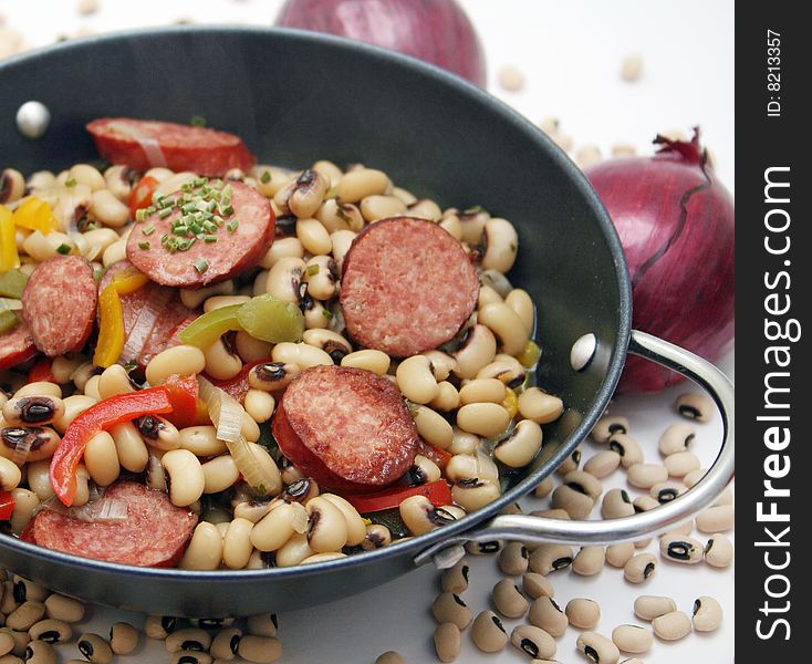 A fresh stew of beans and vegetables with sausage