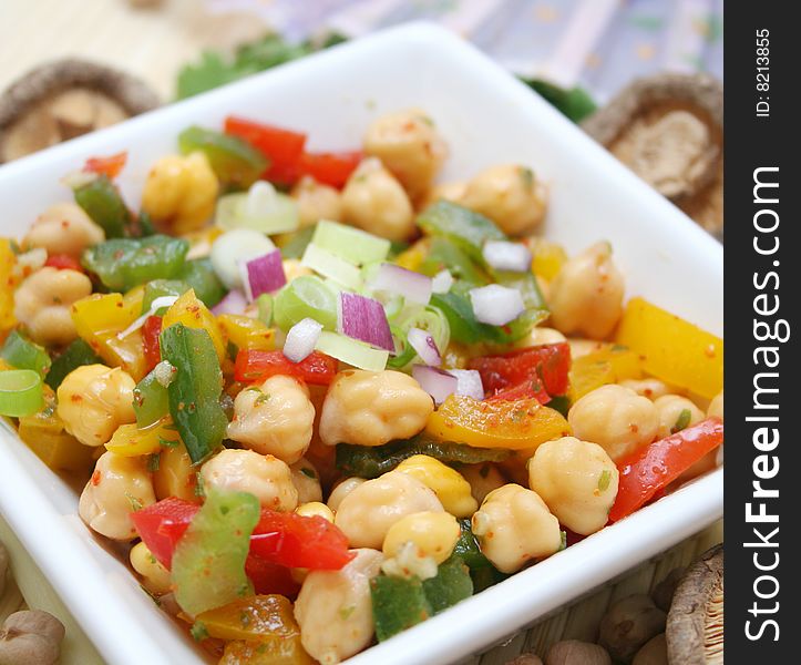 A fresh salad of chick peas with paprika and onions