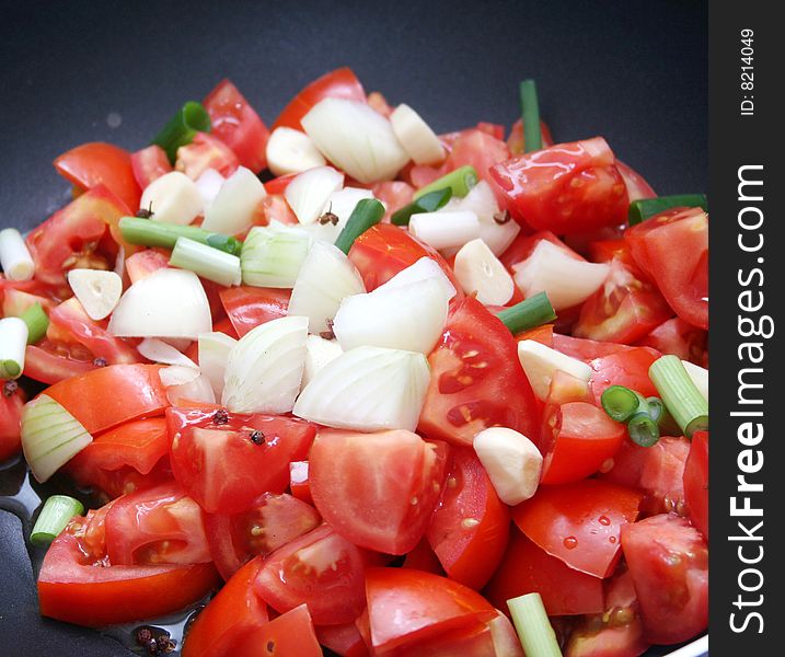 Fresh vegetables for cooking a tomato-sauce
