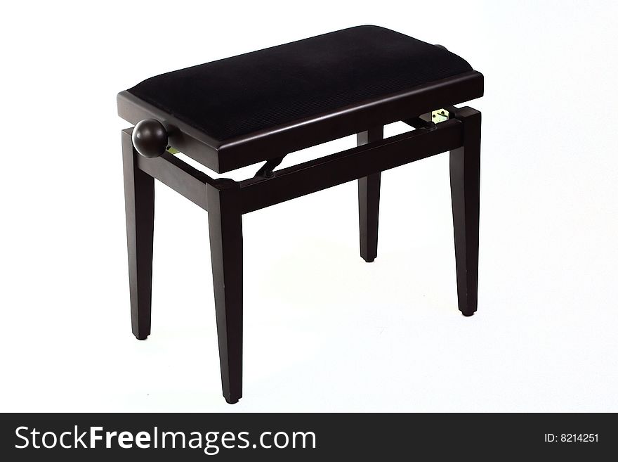 Black piano stool isolated over white