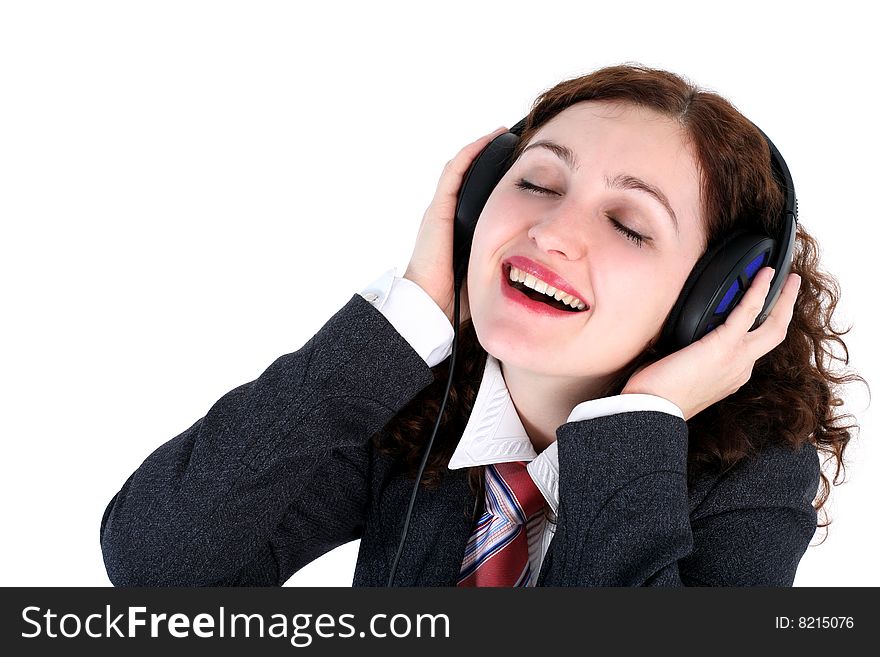 Listening - girl in headphones isolated on white