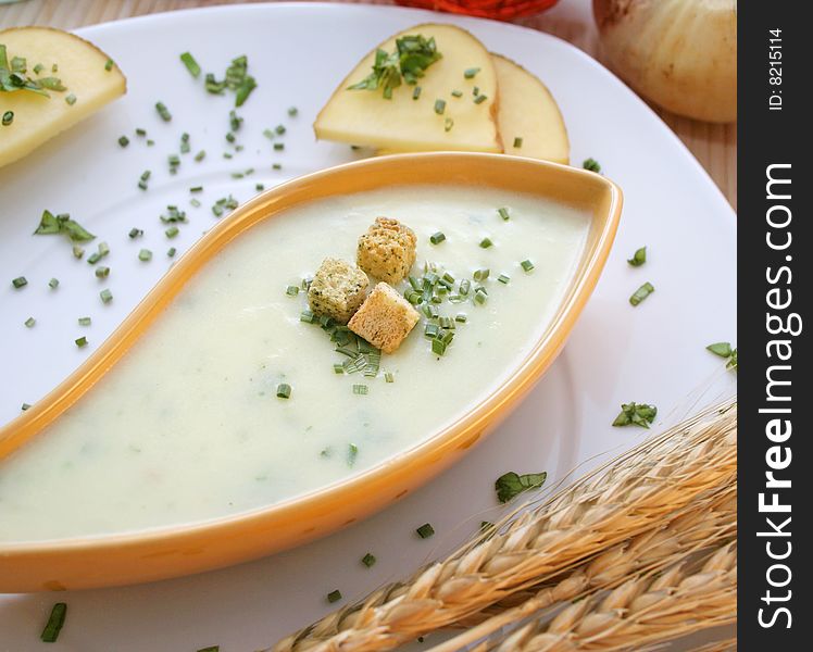 A fresh soup of potatoes with some croutons