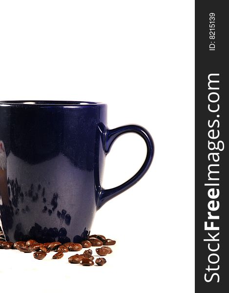 Isolated shot of coffee mug and coffee beans. Isolated shot of coffee mug and coffee beans
