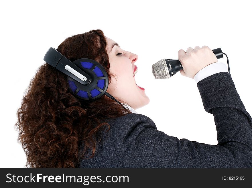 Singing girl in headphones with mic  isolated on white