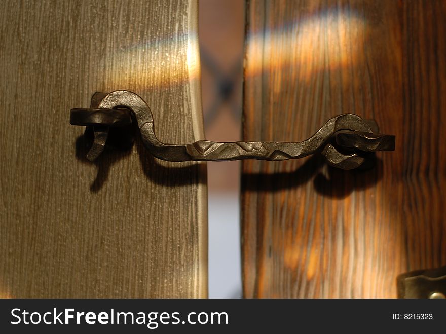 Metallic Hook On A Vintage Wooden Door