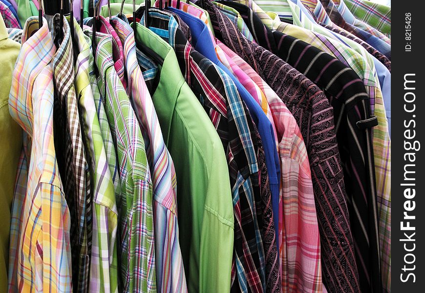 A rack full of colorful shirts.