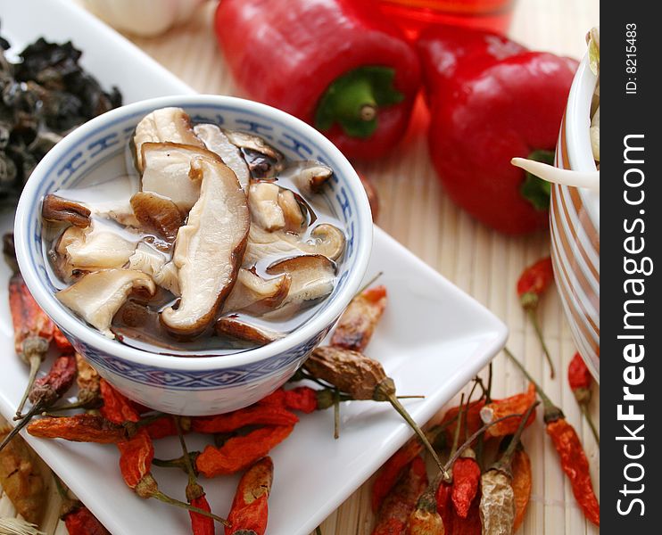 Some asian shiitake mushrooms and dry chili. Some asian shiitake mushrooms and dry chili