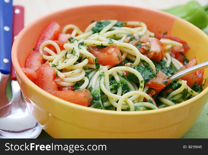 Fresh italian pasta with spinach and tomatoes. Fresh italian pasta with spinach and tomatoes