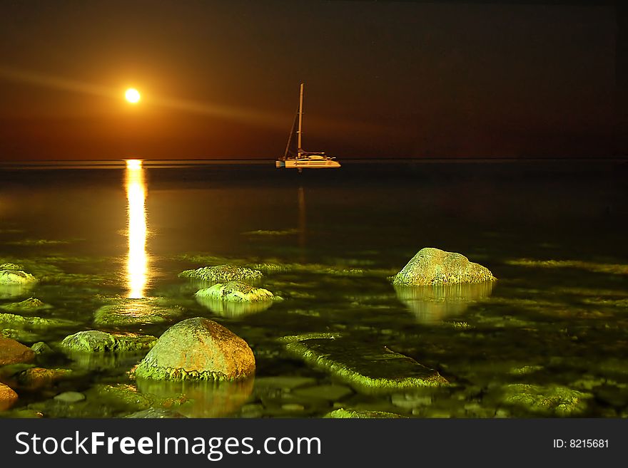 Night landscape with yacht and moon