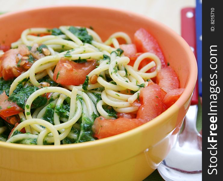 Fresh italian pasta with spinach and tomatoes. Fresh italian pasta with spinach and tomatoes