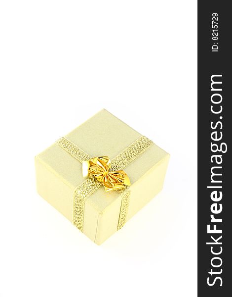 Gold color wrapped gift box witch bow