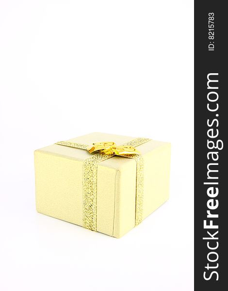 Gold color wrapped gift box witch bow. Gold color wrapped gift box witch bow