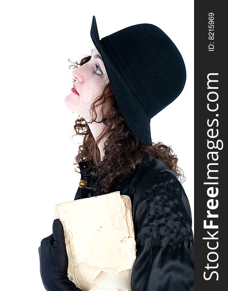 Girl in hat with old book isolated on white. Girl in hat with old book isolated on white