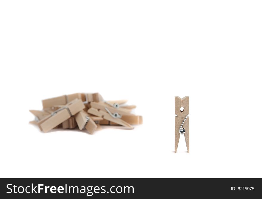 Isolated wood clothes pegs like leader