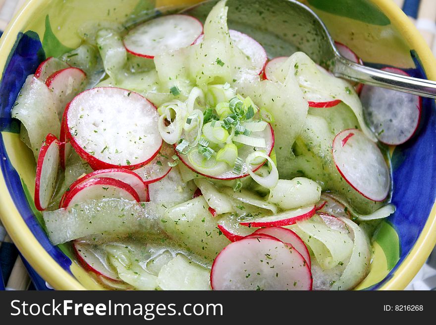 A fresh salad of cucumbers and red radish