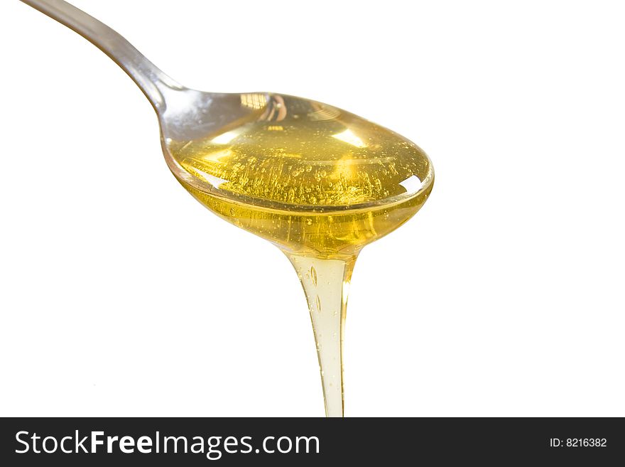 Golden honey isolated on white background