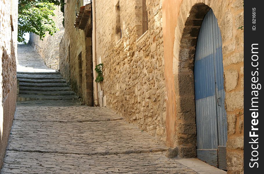 Muddy street and buildings made of stone