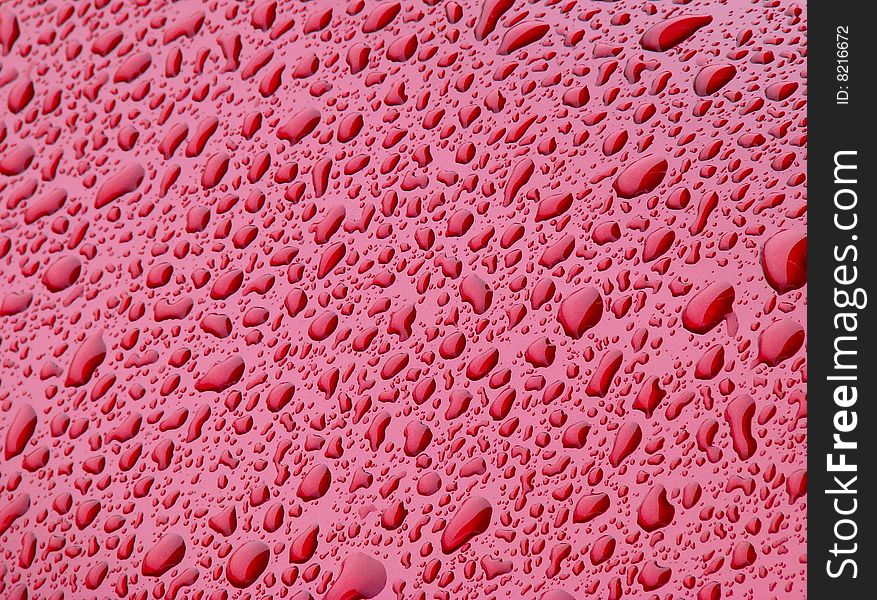 Water drops on red background