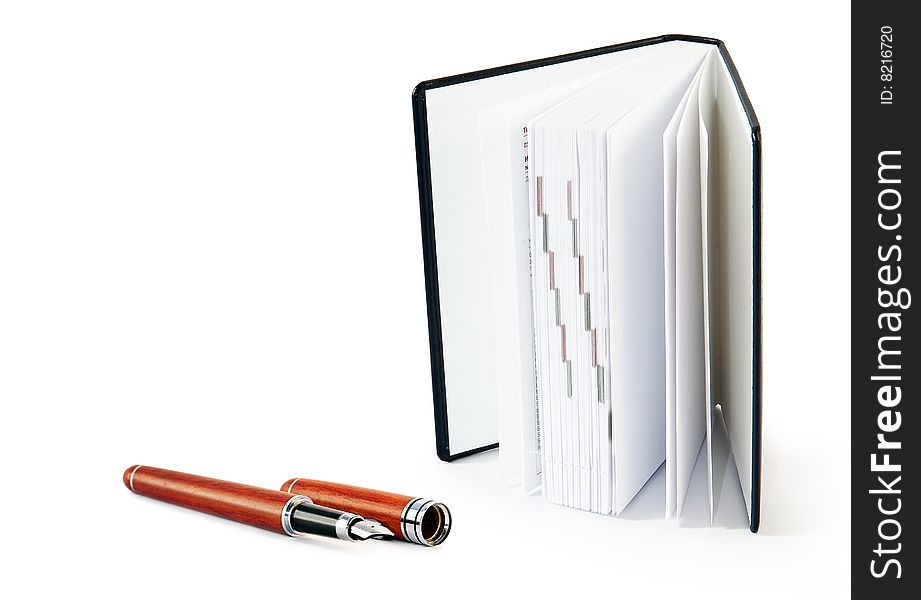Notepad with   fountain pen  on white background. Notepad with   fountain pen  on white background
