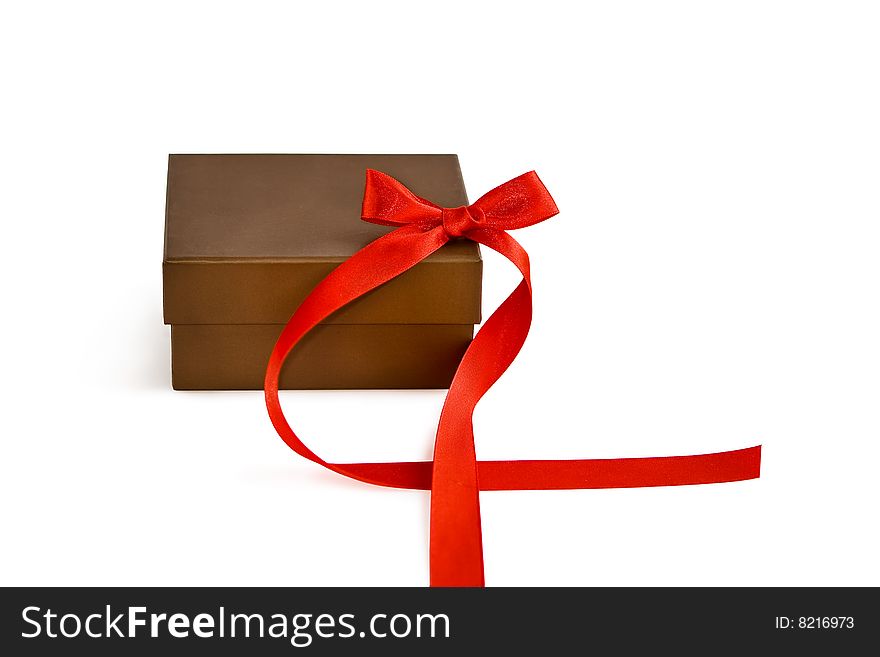 Gift box with red ribbon over a white background