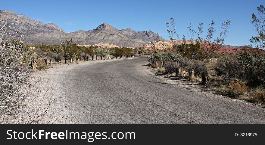 A Lone Stretch of Highway Winding Through the Desert. A Lone Stretch of Highway Winding Through the Desert