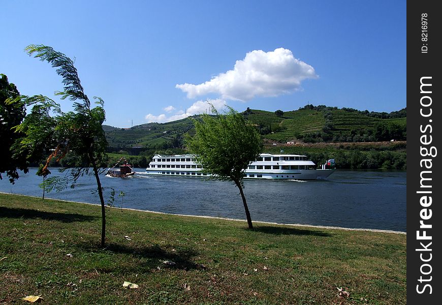 Big cruiser boat going down the river. Big cruiser boat going down the river